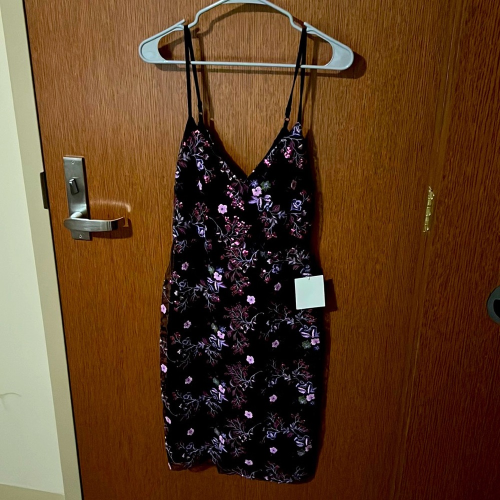 Selling a beautiful black and purple embroidered dress from Lulus!